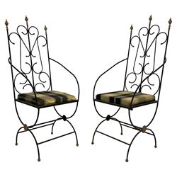 Pair Gothic design wrought metal throne chairs, high back with gilt finials and scrolling design, on curved X-frame base with gilt rosette, upholstered drop-in seat