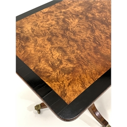 20th century birch tilt top occasional table, the rectangular top with ebonised crossband over octagonal pedestal and three out splayed supports terminating in hairy paw brass castors 
