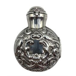 Late Victorian silver cased scent bottle, the hinged case chased with birds and scrolls, opening to reveal a green glass flask, the hinged cover locking in the glass stopper H7cm London 1897 Maker William Comyns