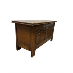 Strongbow Furniture oak blanket box of traditional design, the lifting top over linen carved base, raised on stile supports W99cm, H52cm, D40cm