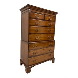 George III oak and mahogany chest-on-chest, projecting shaped cornice, fitte with two short and six long drawers each with moulded edges and brass handles, raised on bracket feet