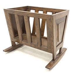 20th century oak Canterbury magazine rack, with slatted sides and panelled ends raised on sledge supports 