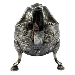 18th century Irish silver sauce boat, later decorated with embossed birds and flowers, C scroll handle, no date letter but bears the makers mark 'I.W'. This mark has been variously ascribed to John Williamson, James Whithorne and John Wilme