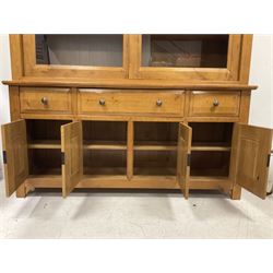 Large French oak dresser, the top section enclosed by two sliding glazed doors, the base fitted with three drawers and cupboards