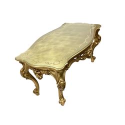 Italian Rococo style gilt coffee table, shaped serpentine top, the apron with central cartouche flanked by scrolling, raised on scrolled cabriole supports, retailed by Silik Lo Stile Di Classe