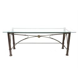 Wrought metal console table, the glass top over reeded cylindrical supports with bowed stretchers 