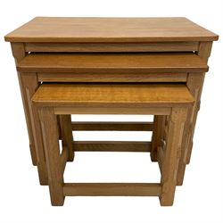 Mouseman - nest of three oak occasional tables, rectangular adzed tops on octagonal supports, each carved with mouse signature, by the workshop of Robert Thompson, Kilburn