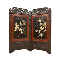 Japanese carved and lacquered hardwood two fold screen, pierced and carved pediment with birds and foliate decoration, central panels decorated with Shibayama design moulding depicting birds and trees, on castors, each panel 86cm x 183cm
