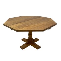 Wrenman - adzed oak dining table, octagonal top on carved pedestal base, cruciform sledge feet with scroll carved terminals, carved with proud wren signature, by Robert (Bob) Hunter of Thirlby