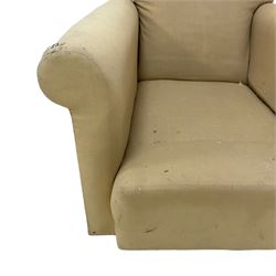 Late 19th to early 20th century armchair, traditional shape with rolled arms and sprung seat, on castors