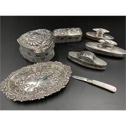 Edwardian embossed silver dressing table tray, hallmarked The Alexander Clark Manufacturing Co, Sheffield 1905, two similar cut glass dressing table jars, one in the form of a heart, three silver mounted nail buffers and a George V mother of pearl and silver fruit knife hallmarked William Needham, Sheffield 1934, total weighable silver 2.58 ozt 