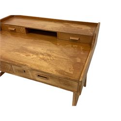 Arne Wahl Iversen for Vinde Mobelfabrik - mid-20th century Danish teak writing desk, model 64, raised back shelf fitted with central pigeon hole flanked by two drawers, rectangular writing surface fitted with two larger drawers, raised on splayed tapering supports united by stretcher, VM stamp to base and 'Danish Furniture Makers Control' stamp to drawer