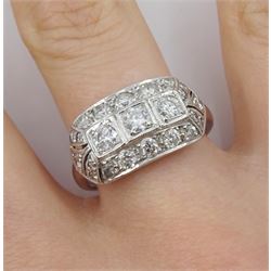 White gold milgrain set diamond curved panel ring, three round brilliant cut diamonds, with pierced diamond set surround, stamped 18ct, total diamond weight approx 1.10 carat
