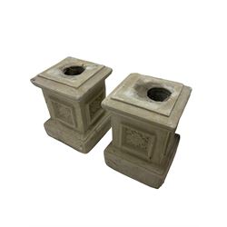 Pair of stone garden plinths with carved folate design 