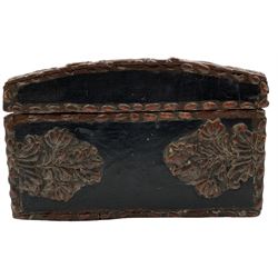 Continental, possibly Italian composition casket, polychrome decorated and applied with scrollwork borders and the slightly domed cover with central armorial motif displaying an endless knot motif, surmounted by a bird, L28cm 
