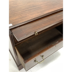20th century George III style mahogany chest, the top with applied moulding over brushing slide and three cock beaded drawers with brass drop handles, raised on shaped bracket supports