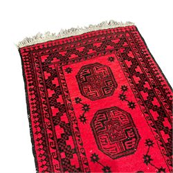 Persian Bokhara red ground runner, the field decorated with eight Gul motifs, geometric design border and guard stripes