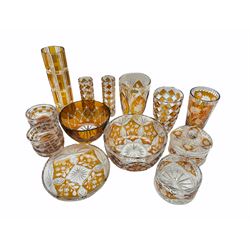 A group of Polish flash amber glassware to include three vases by 'Julia', six dessert bowls, large etched glass fruit bowl, jar and cover and other pieces 
