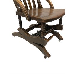 20th century 'American' rocking chair, the elm seat over a spring mechanism 