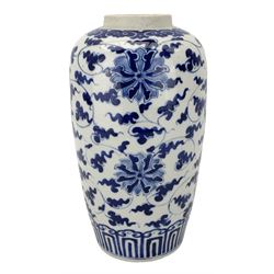 19th century Chinese porcelain vase and cover, of tapered form, painted in underglaze blue with stylized flowers and scrolling foliage, within a ruyi lappet border, H25cm 