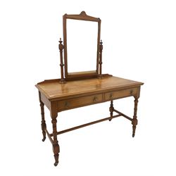 Victorian pine mirror back dressing table, the swing mirror over two drawers, raised on turned supports united by a stretcher, terminating in ceramic castors W123cm, H165cm, D60cm