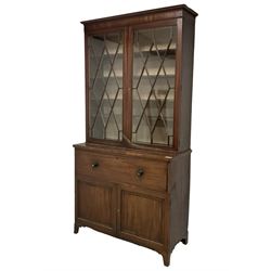 Regency mahogany secretaire bookcase, the upper section with adjustable shelves enclosed by astragal glazed doors, cock-beaded fall front secretaire drawer fitted with small drawers, pigeonholes and cupboard, double panelled cupboard below enclosing one long and four short drawers, bone escutcheon, on splayed bracket feet 