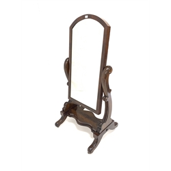 Victorian mahogany cheval dressing mirror, with original arched swing mirror plate, raised on floral carved uprights leading to platform and four out splayed supports terminating in castors 