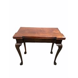 George II mahogany fold over tea table, the shaped top with candlestick corners folding on single gate leg, raised on cabriole supports W80cm