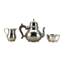 Silver three piece teaset, the teapot of baluster form with domed cover and stained handle London 1934 Maker Harman & Co