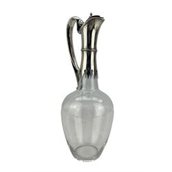 Victorian plain glass claret jug of ovoid form with silver mounts and loop handle H31cm Sheffield 1874 Maker Martin Hall & Co