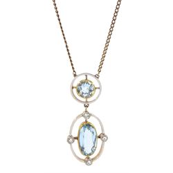 Early 20th century 15ct gold and platinum, milgrain set aquamarine and diamond pendant, on later 9ct gold trace link chain necklace