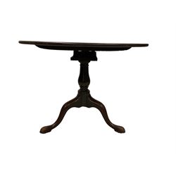 George III mahogany tilt-top tea table, circular top over bird cage bracket, turned vasiform pedestal terminating in tripod base with cabriole supports on brass castors
