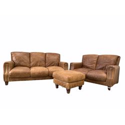 Traditional brown leather upholstered in studded tan leather, (W185cm) together with a matching two seat sofa (W138cm) and footstool (62cm)