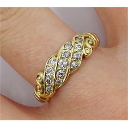 Early 20th century gold three row diamond ring, with scroll shoulders, stamped 15ct