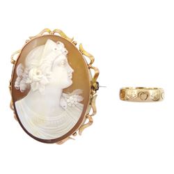 Gold wedding band, with engraved heart and flower decoration and a gold cameo brooch, both 9ct