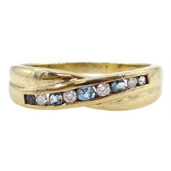 9ct gold channel set round blue topaz and diamond crossover ring, hallmarked