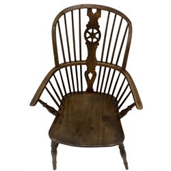 19th century elm and ash Windsor chair, high stick back with pierced wheel beech splat, raised on turned supports united by H-stretcher