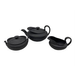 19th century Wedgwood black basalt three-piece tea set, each of semi fluted form comprising teapot, sucrier and milk jug 