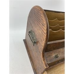 Early 20th century oak stationery cabinet with domed top and enclosed by a tambour shutter with divided interior, single base drawer and perpetual calendar W30cm