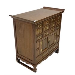 Korean hardwood chest, fitted with fourteen drawers and two cupboards
