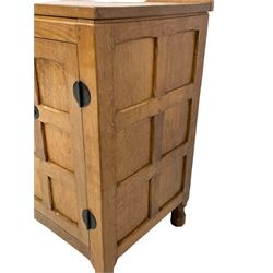 'Oakleafman' oak dresser base, all-over adzing, fitted with four drawers and two cupboards, wrought metal fittings, panelled doors and sides, the left-hand side carved with leaf signature, by David Langstaff of Easingwold
