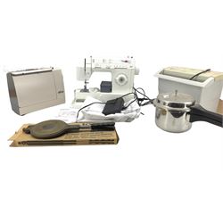 Singer electric sewing machine with instruction manual, Elna sewing machine, paper shredder, Jotul cookie press and a pressure cooker