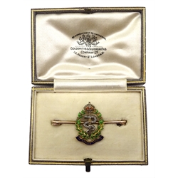Royal Army Medical Corps gold brooch, enamelled motto 'In Arduis Fidelis', wreath and crown, the serpent set with diamonds and emerald eyes, retailed by The Goldsmiths & Silversmiths Company Ltd, London, in original fitted case