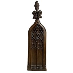 Oak church pew end, carved in gothic revival style with acanthus leaves, topped with Fleur de lis finial H138cm