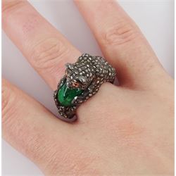 Gold and silver diamond set panther ring, with ruby eyes, holding a cabochon emerald, total diamond weight approx 1.85 carat, emerald approx 3.25 carat