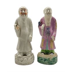 18th century Chinese figure of an Immortal wearing a pink cloak and holding a fly whisk, the base formed as waves H20cm and another similar figure (2)