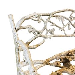 Late 19th to early 20th century cast iron faux bois garden bench, decorated with trailing foliage branches, in white paint finish