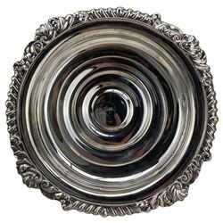 Pair of silver bottle coasters with gadrooned and shell moulded borders on a wooden base D16cm