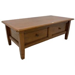Contemporary light oak coffee table, the projecting hinged rectangular top enclosing drinks unit compartment, over panelled sides, on square supports