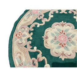 Chinese design turquoise ground rug, the field with central ovoid rose and ivory floral medallion, matching border with foliate designs and C-scrolls and another of circular form (2)